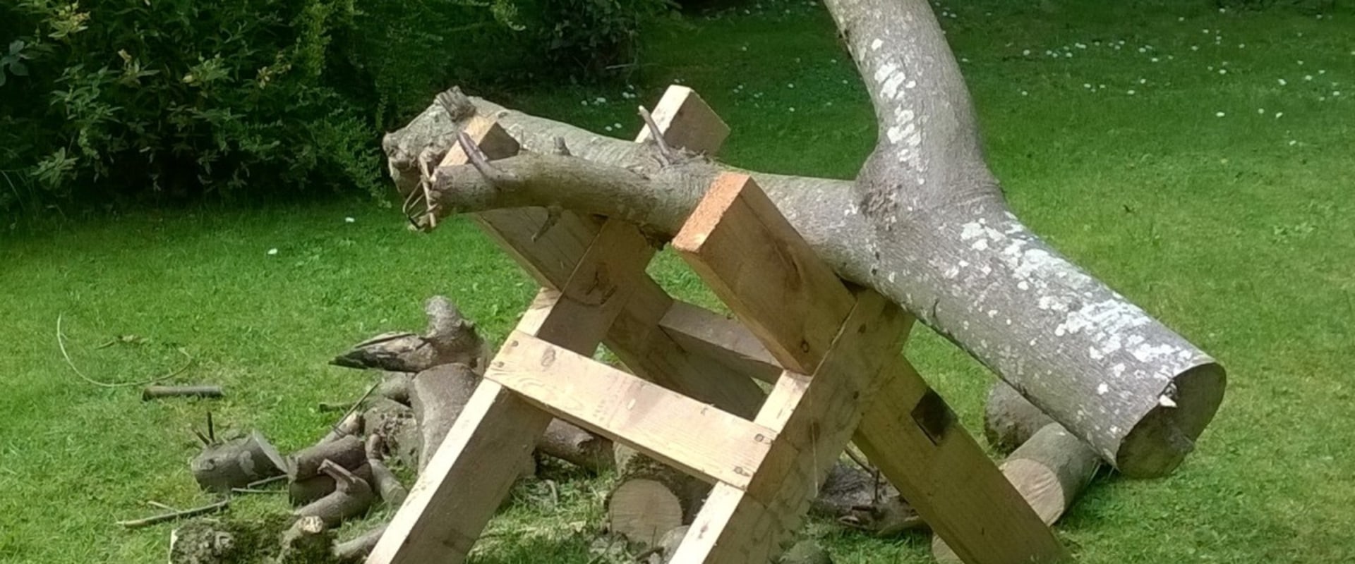 Which tool is used to cut trees and wooden logs?